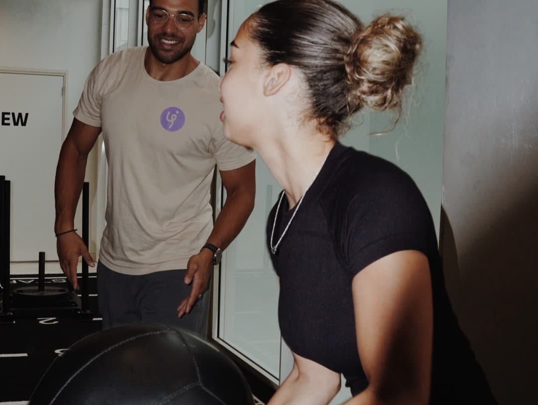 Physiotherapist guiding patient through exercises